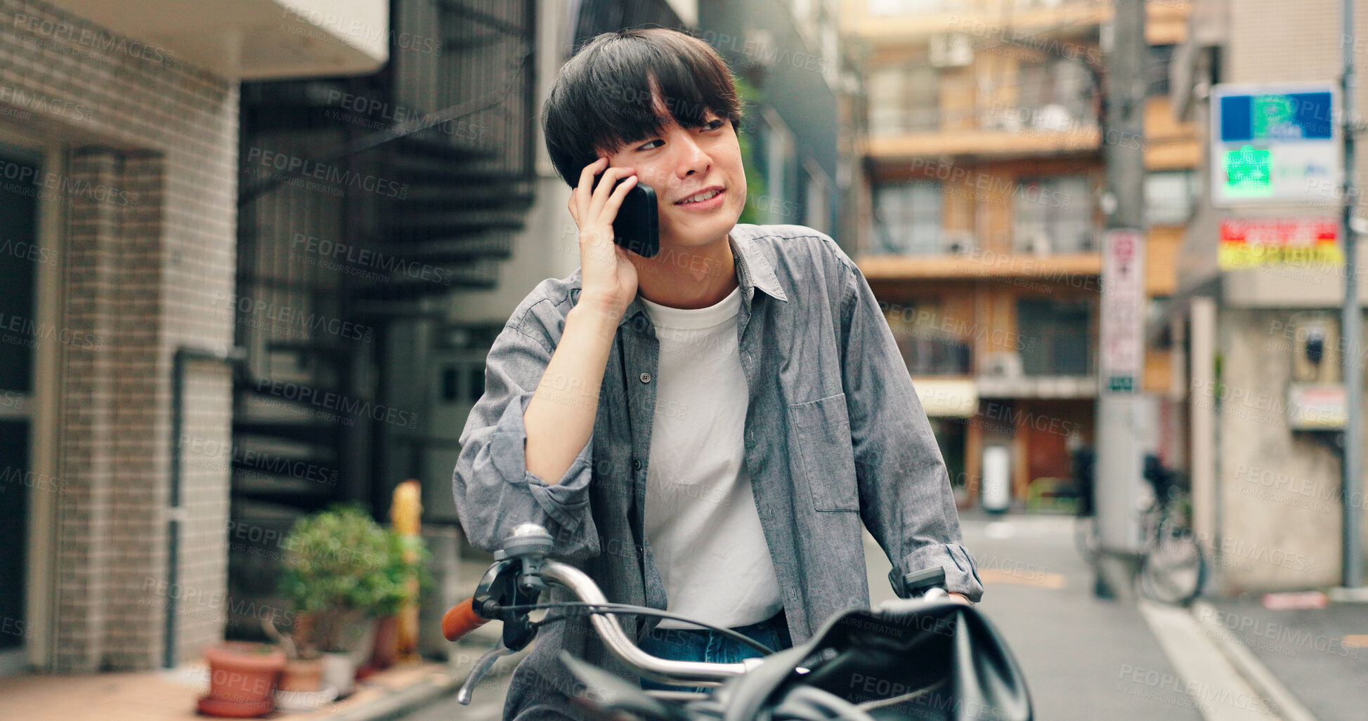 Buy stock photo Phone call, bicycle and happy with Japanese man in city for location, direction and travel. Social media, cycling and mobile app with person and bike in japan for communication, trip and adventure