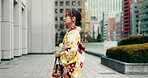 Morning, walking and woman in city with kimono, weekend commute and outdoor sightseeing in traditional clothes. Explore, discover and girl on street with Japanese fashion, culture and urban adventure