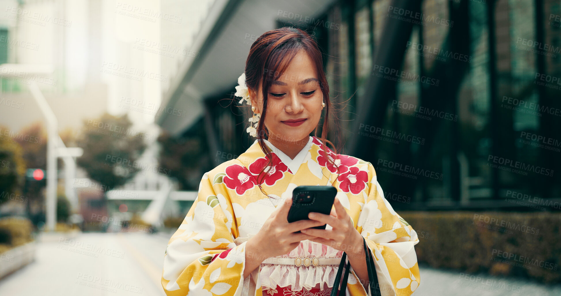 Buy stock photo Asian woman, kimono and typing with phone in city for communication, travel or chatting. Japan, female person or tourist with mobile smartphone for travel, online texting or app in an urban town