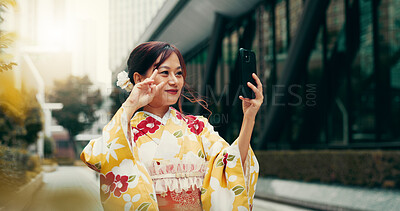 Buy stock photo Selfie, peace sign and kimono with Japanese woman in city for profile picture, memory and traditional clothes. Travel, social media and content creator with person for heritage, culture and update