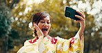 Selfie, excited and kimono with Japanese woman in city for profile picture, memory and traditional clothes. Travel, social media and content creator with person for heritage, culture and update