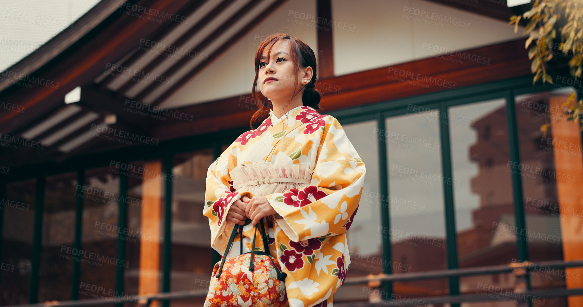 Buy stock photo Fashion, culture and woman at temple with kimono, thinking and waiting at outdoor building with respect. Style, design and confident girl with traditional Japanese clothes, bag and hostess at pagoda