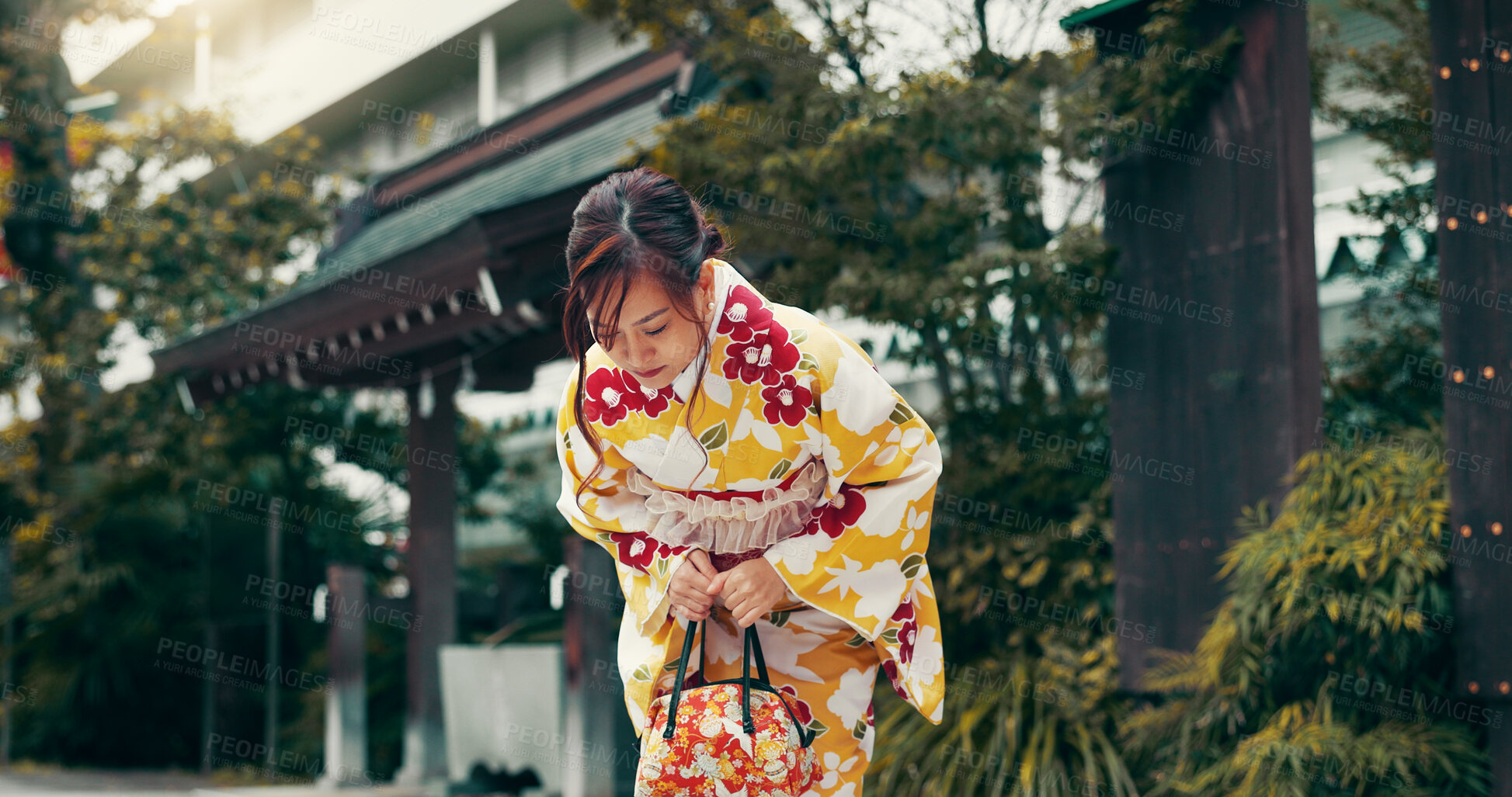 Buy stock photo Bow, kimono and Asian woman in city for ceremony, ritual and respect at temple in Japan. Outdoors, culture and person in traditional clothes with gesture for gratitude, prayer and custom in town