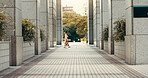 Woman, kimono and walking in city, buildings and travel with profile on urban sidewalk in summer at park. Person, outdoor and traditional fashion with style, clothes and heritage on commute in Japan