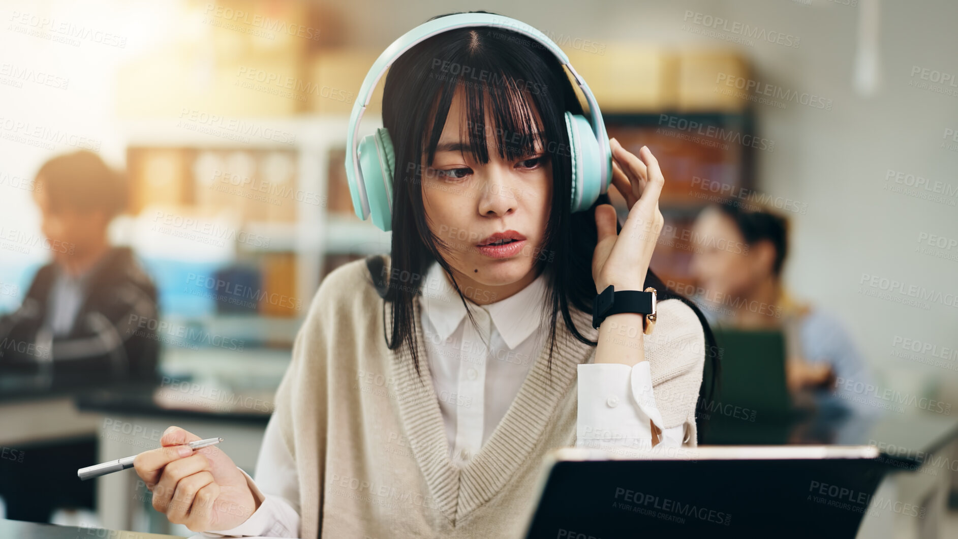 Buy stock photo Headphones, tablet and woman at university with notes for literature assignment in class. Reading, pen and Japanese female student with digital technology studying for college exam, test or project.