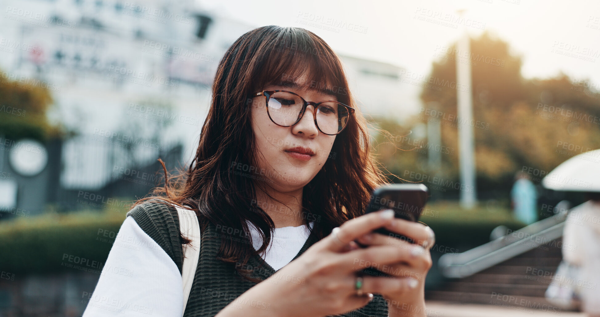 Buy stock photo Woman, typing and phone for travel in city of Japan, walking and online for professional chat. Female person, commute and urban town for communication on app, business website and worker consulting