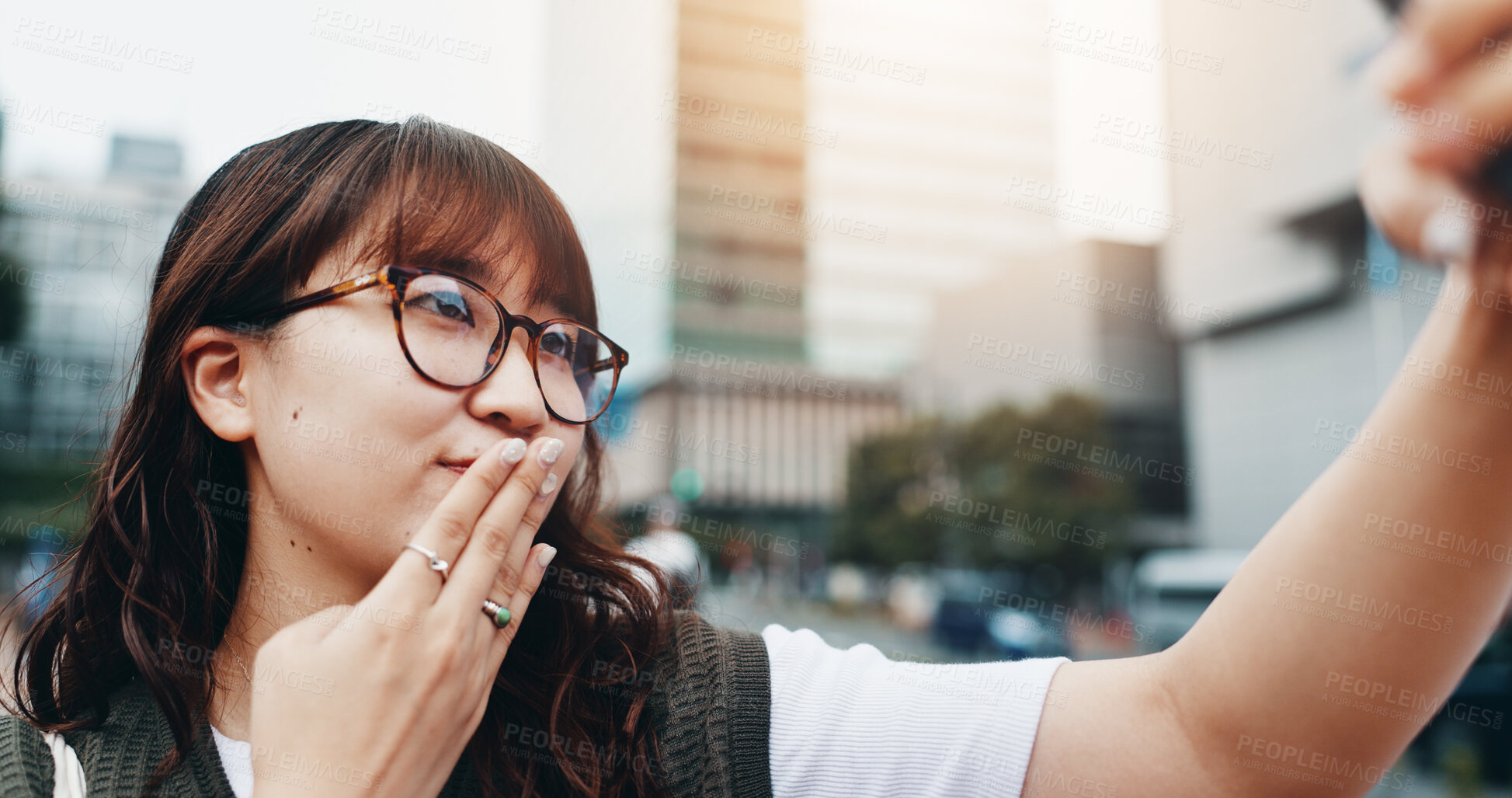 Buy stock photo Japanese woman, selfie and travel in street with kiss, sign and outdoor in summer with post on web. Girl, person and influencer with emoji, symbol and live streaming with social media in urban city