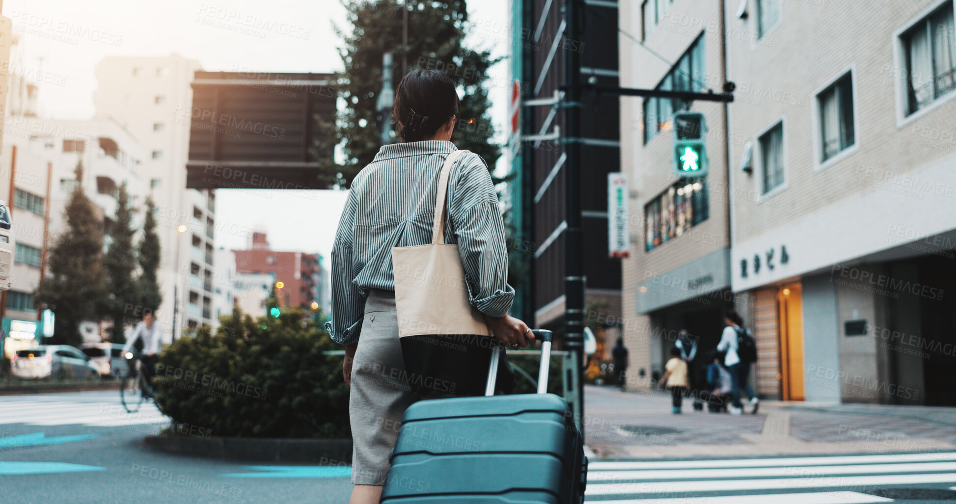 Buy stock photo Walking, suitcase and woman in city for travel with international exchange student program. Luggage, education and back of female person on commute journey in town for university or college in Japan.