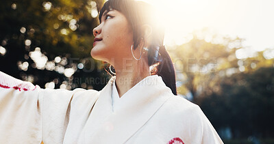 Buy stock photo Travel, woman and thinking outdoor at park with traditional kimono, sightseeing nature and cultural journey. Japanese person, thoughtful and gratitude for scenery with reflection, memory or adventure