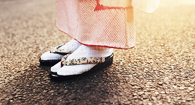 Buy stock photo Traditional sandals, kimono and street with Japanese person with travel, commute and outdoor in sunshine. Shoes, culture and feet with indigenous fashion in city, ground and asphalt on urban road