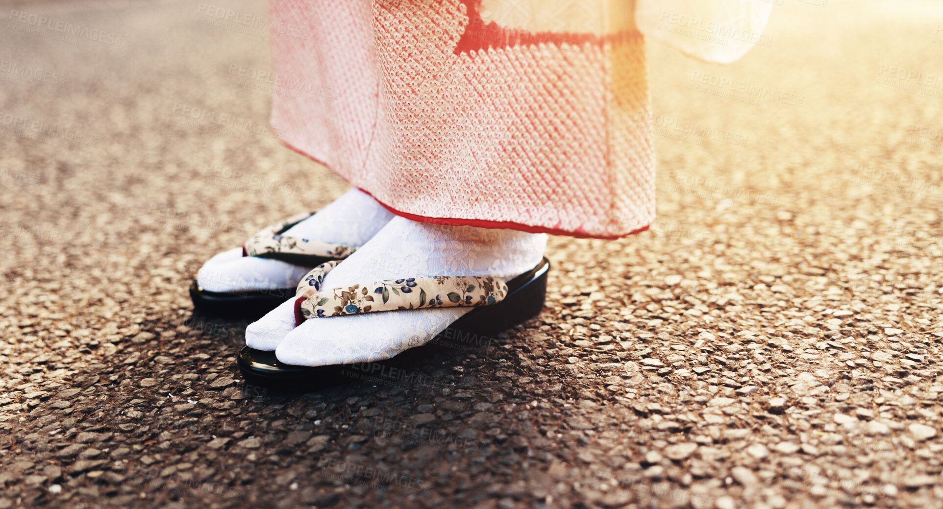 Buy stock photo Traditional sandals, kimono and street with Japanese person with travel, commute and outdoor in sunshine. Shoes, culture and feet with indigenous fashion in city, ground and asphalt on urban road