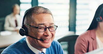 Buy stock photo Business, smile and man in office, telemarketing and help desk with headset, contact us and Japan. Mature person, employee or agent with telecom sales, customer service and call center in workplace