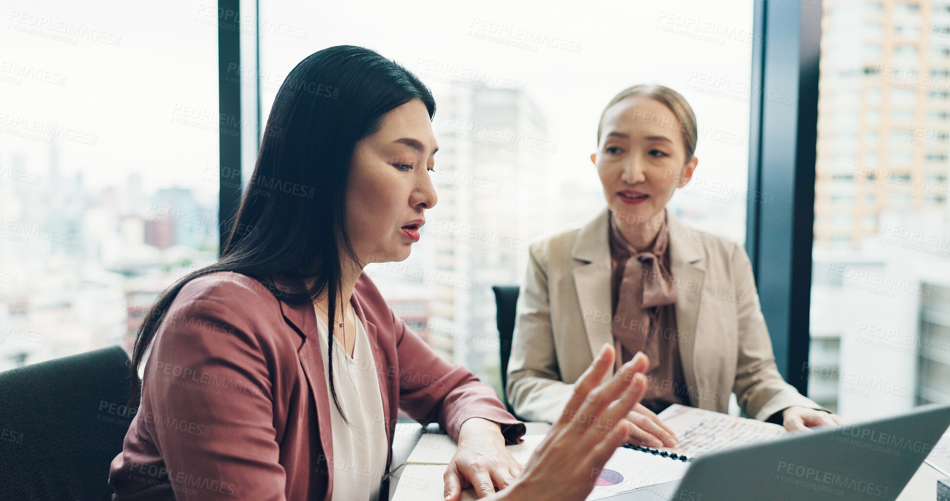 Buy stock photo Business people, laptop and discussion in office for planning, collaboration and company financial review. Japan, tech and executive meeting for investment proposal, teamwork and project feedback