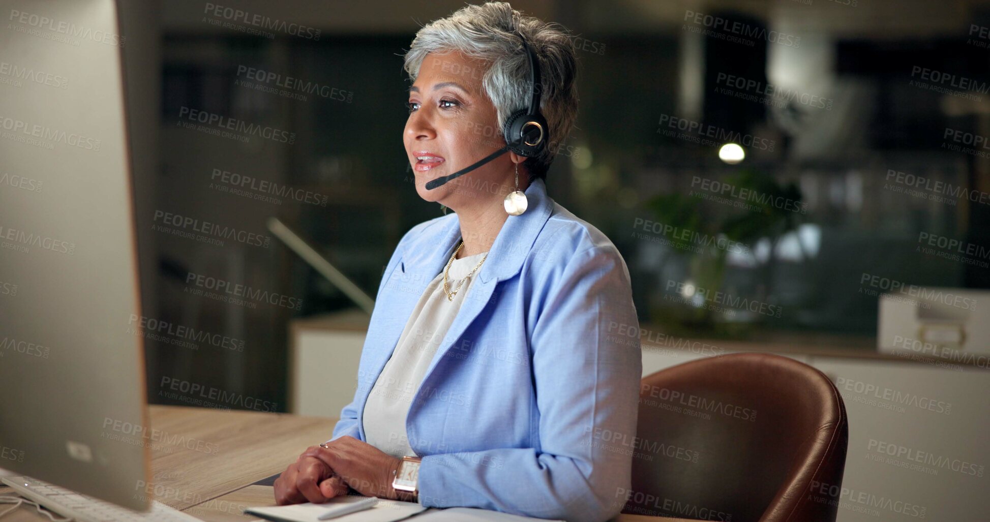 Buy stock photo Call center, computer and mature woman telemarketing, consulting or help desk at night in office. Headset, insurance agent and customer service for support, business advice and contact us on deadline