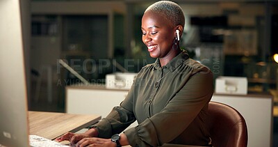 Buy stock photo Black woman, typing and computer in office for news, business research and planning at night. Economy journalist, happy or tech in agency for article productivity, proofreading or editing information
