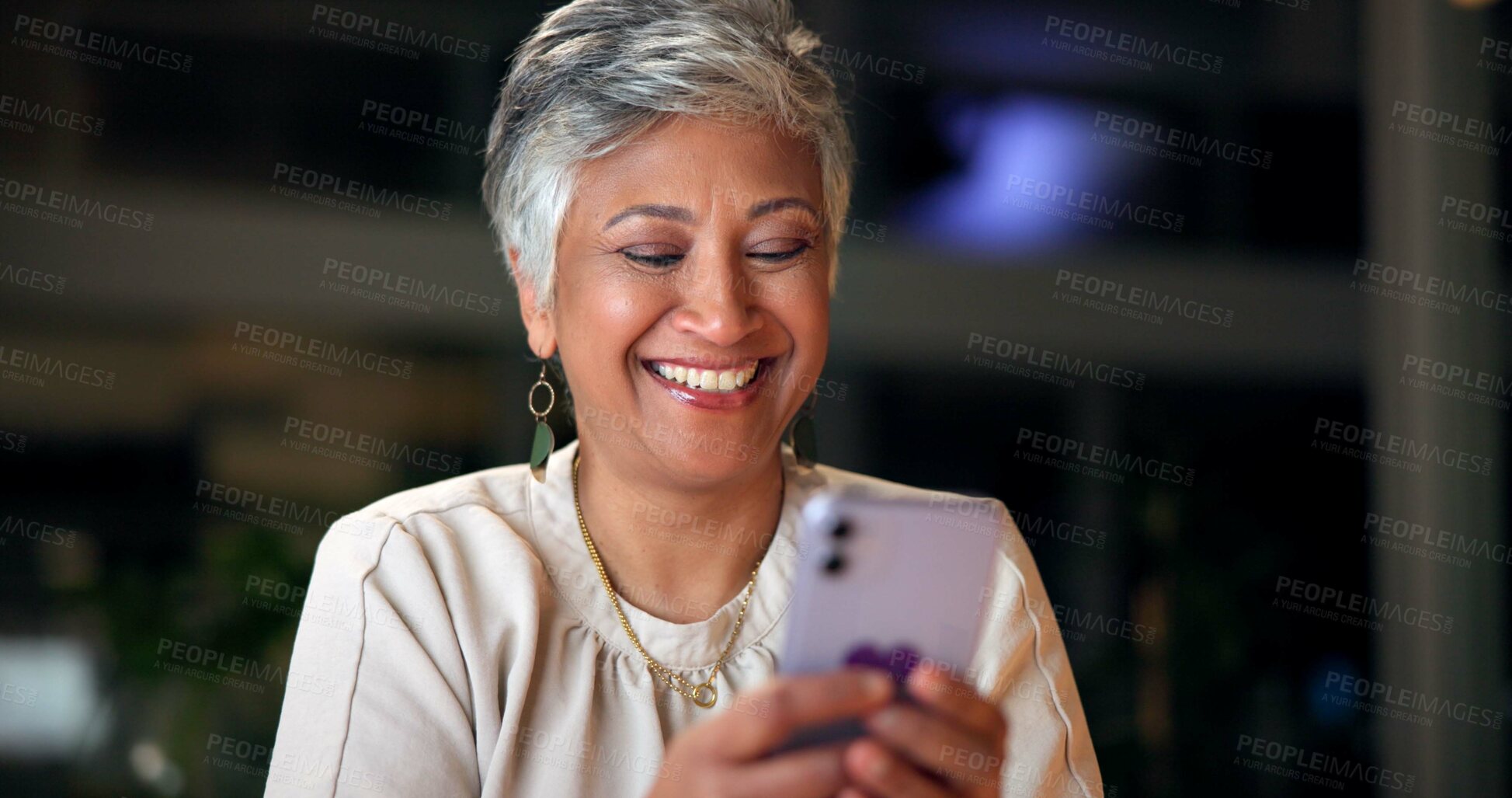 Buy stock photo Phone, happy and mature businesswoman in office at night with communication, networking and contact. Laugh, cellphone and finance planner with funny email for international client investment report.