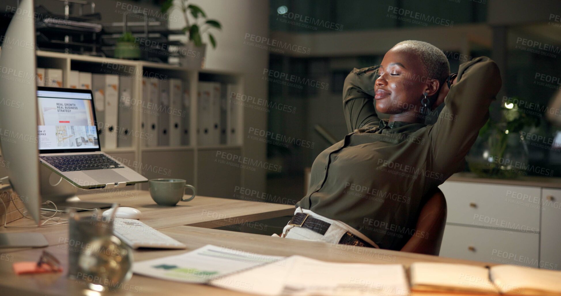 Buy stock photo Black woman, relax and night with break at office for done, finished or completion by desk. African, female person or employee with smile for rest, productive evening or deadline accomplishment