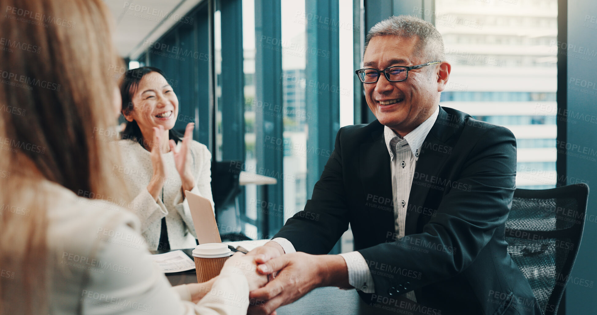 Buy stock photo Cooperation, handshake and business people in meeting, teamwork and promotion with bonus. Japan, group and employees with celebration, collaboration and partnership with success, deal or negotiation