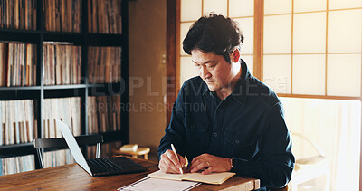 Buy stock photo Writing, laptop and remote work with Japanese man in home office for schedule, planning and idea. Notebook, journal and admin with person and research for freelancer, entrepreneur and brainstorming