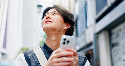 Buy stock photo Japanese, man and thinking with phone in city for communication, travel location and map notification. Person, mobile and website navigation with morning commute, urban view and networking in Japan 