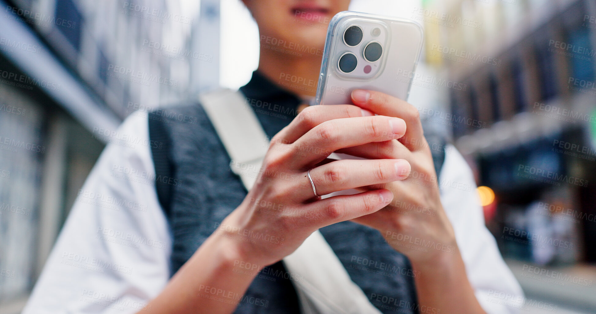 Buy stock photo Hands, person and scroll with phone in city for communication, travel location and map notification. Mobile, social media and contact website with morning commute, schedule transport and urban Japan 