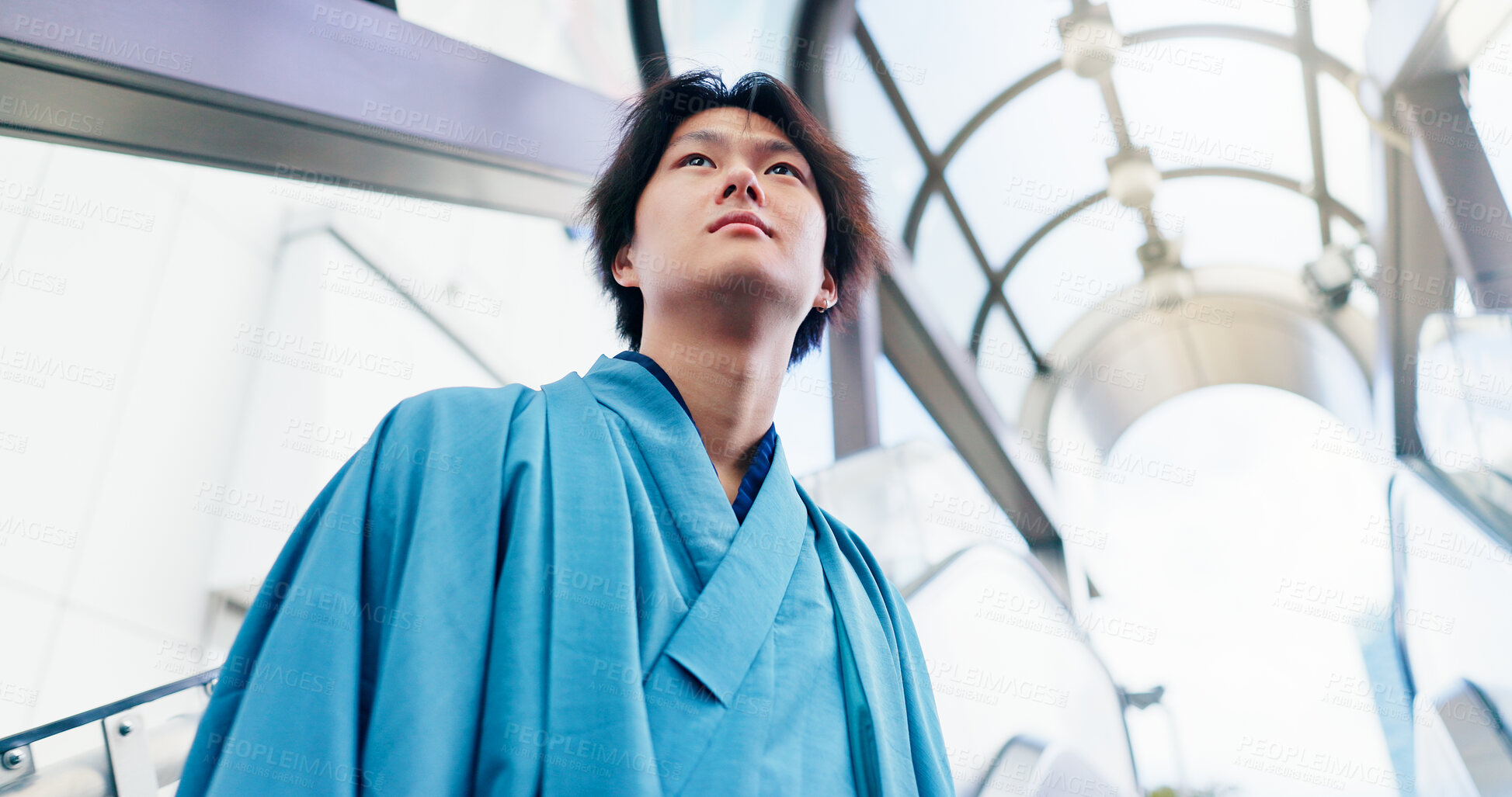 Buy stock photo Man, thinking and escalator with traditional clothes, outfit and yukata for heritage. Japanese guy, holiday and pride for culture, journey and sightseeing with casual dress kimono fashion in city