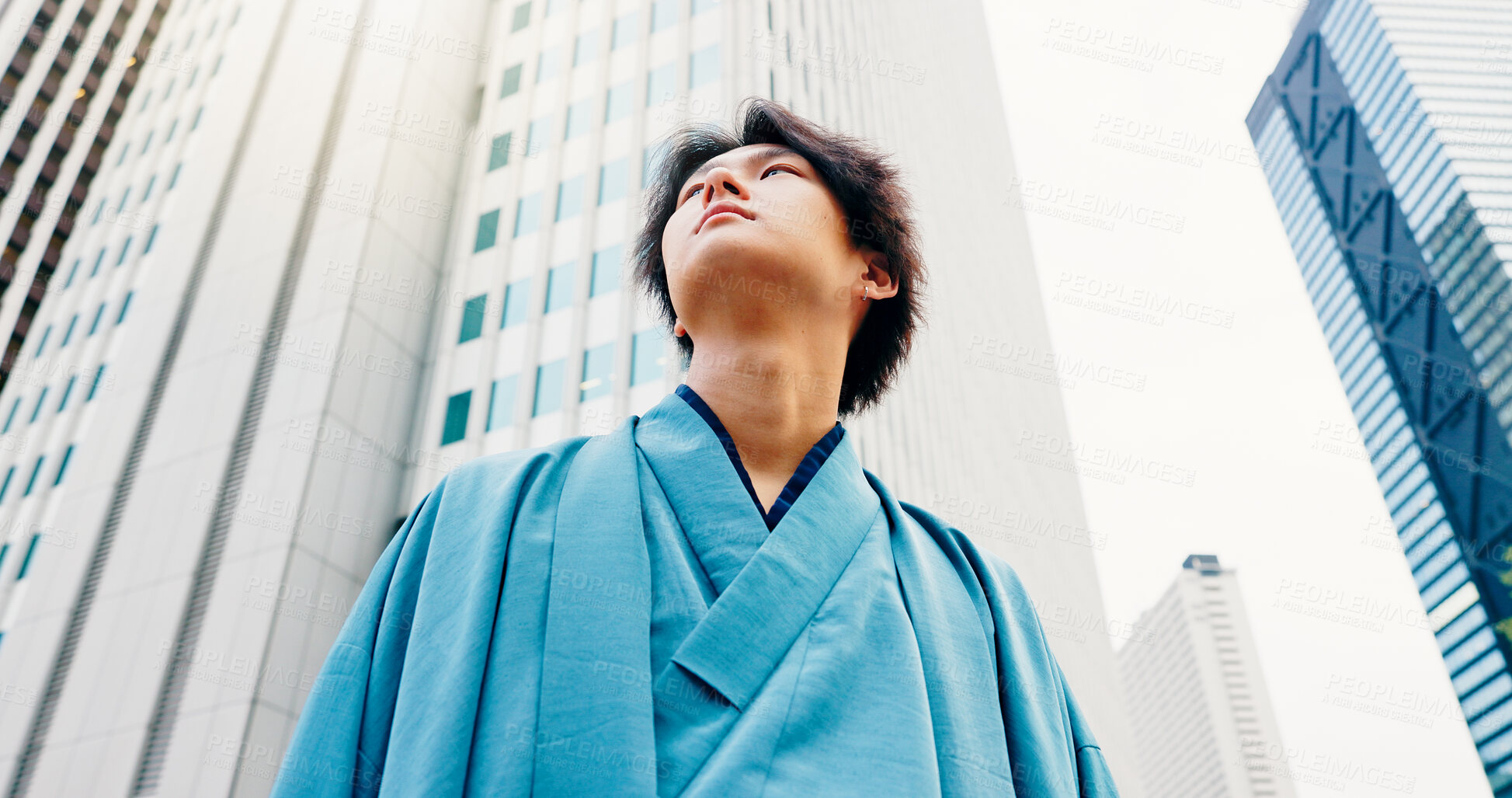 Buy stock photo Japanese man, thinking and city travel with traditional clothes, outfit and yukata for heritage. Below, guy and pride for culture, journey and sightseeing with casual dress kimono fashion downtown