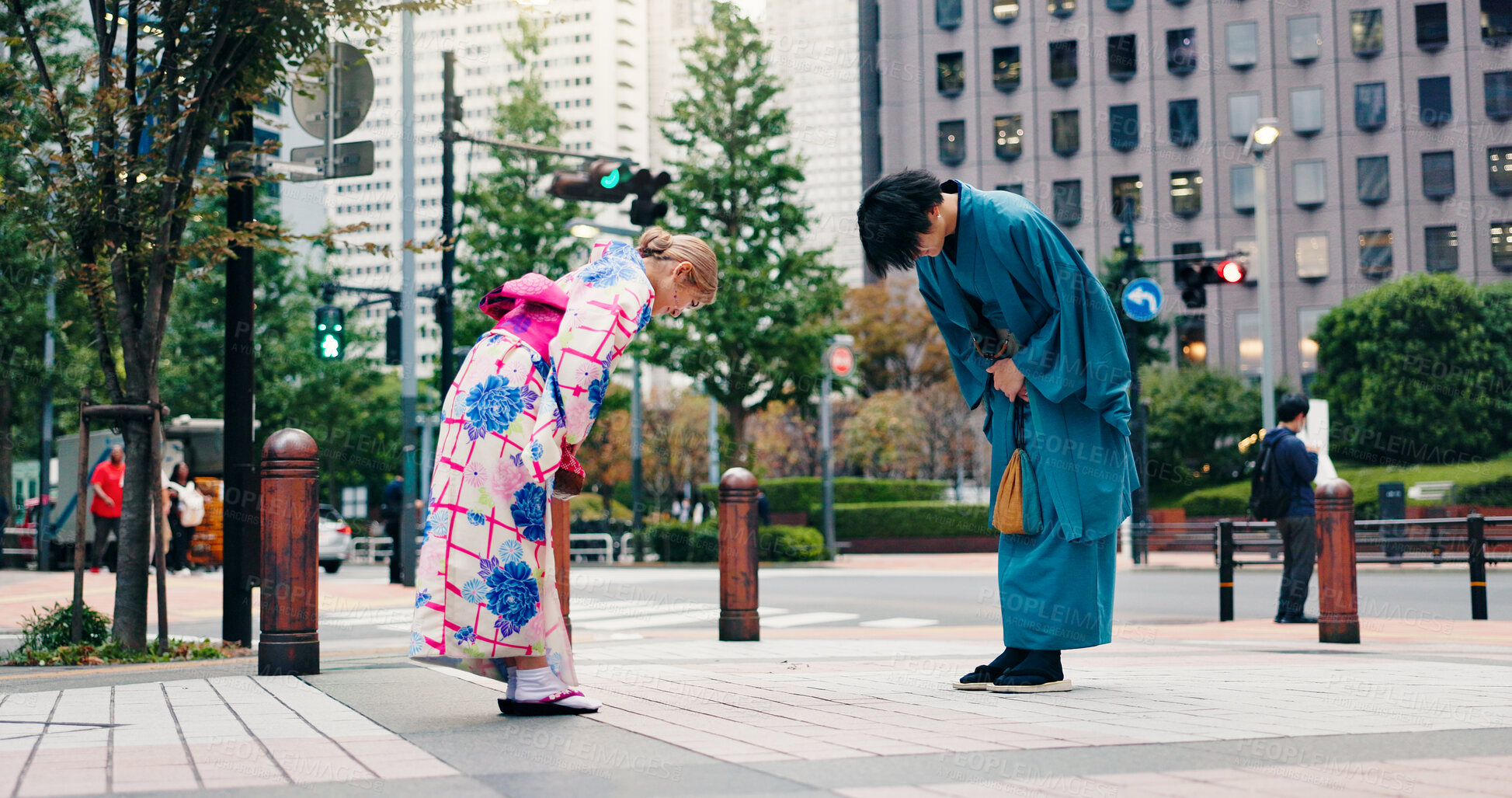 Buy stock photo Respect, japanese people and bow for greeting, culture and welcome with kimono in city. Traditional fashion, man and woman with introduction in urban town for honor, departure and farewell custom