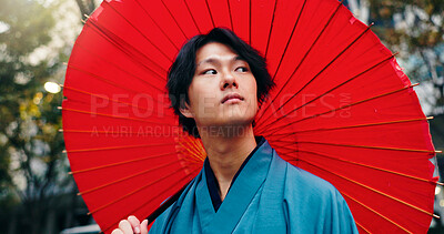Buy stock photo Kimono, umbrella and thinking with Japanese man in city for traditional ceremony, vision and culture. Travel, fashion and pride with person and parasol in Japan for heritage, Buddhist and festival