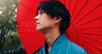 Buy stock photo Kimono, umbrella and reflection with Japanese man in city for traditional ceremony, thinking and culture. Travel, fashion and pride with person and parasol in Japan for heritage, Buddhist or festival