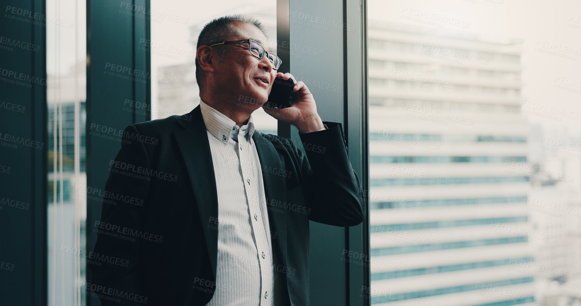 Buy stock photo Japanese, businessman and office with phone call for communication, planning or networking by window. Thinking, male person and mature lawyer with mobile for talking, smile and case detail for client