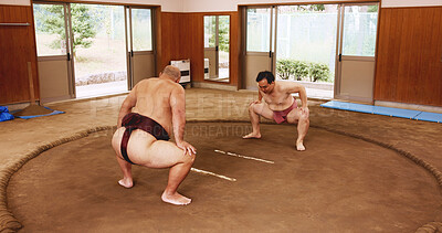 Buy stock photo Men, ring and sumo in Japan for fight, wrestler and exercise with preparation, fitness and technique. Japanese people, competition and sports in dohyo for training, workout and wrestling with match