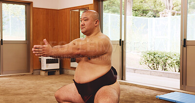 Buy stock photo Athlete, training and exercise for sumo, fitness and wrestler with preparation, skill and technique in ring. Japanese man, fighter and sports in dohyo for culture, workout and wrestling with warm up