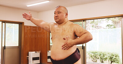 Buy stock photo Athlete, training and exercise for sumo, sports and fitness with preparation, skill and wrestling in ring. Japanese man, fighter and wrestler in dohyo for culture, workout and technique with warm up