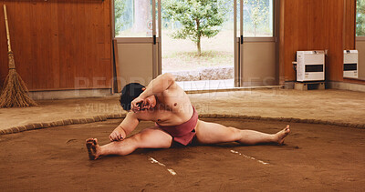 Buy stock photo Athlete, training and exercise for sumo, fitness and splits with preparation, stretching and technique in Japan. Man, fighter and sports in dohyo for practice, workout and wrestling with warm up 