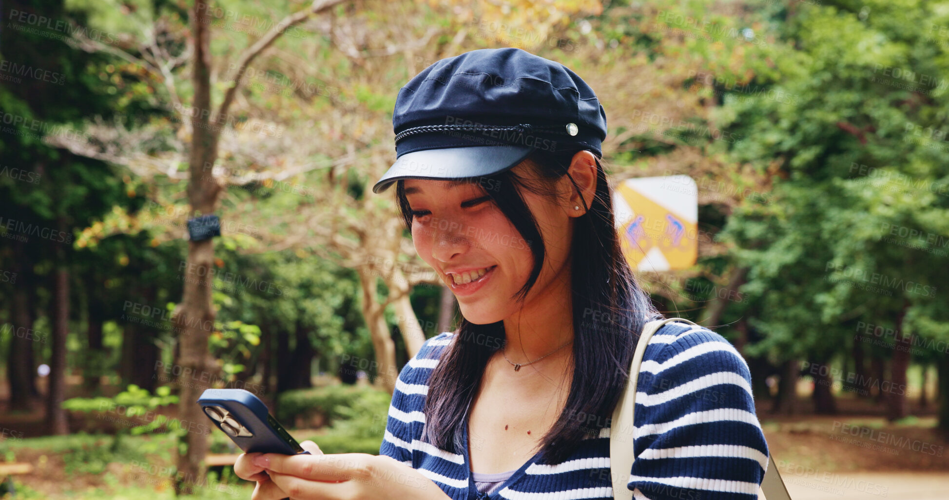 Buy stock photo App, phone and smile with woman in park for adventure, sightseeing or travel to explore Japan. Map, social media and walking with happy tourist person outdoor in nature to search for directions