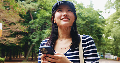 Buy stock photo App, phone and thinking with woman in park for adventure, sightseeing or travel to explore Japan. Directions, idea and social media with smile of happy tourist person in nature to search internet map