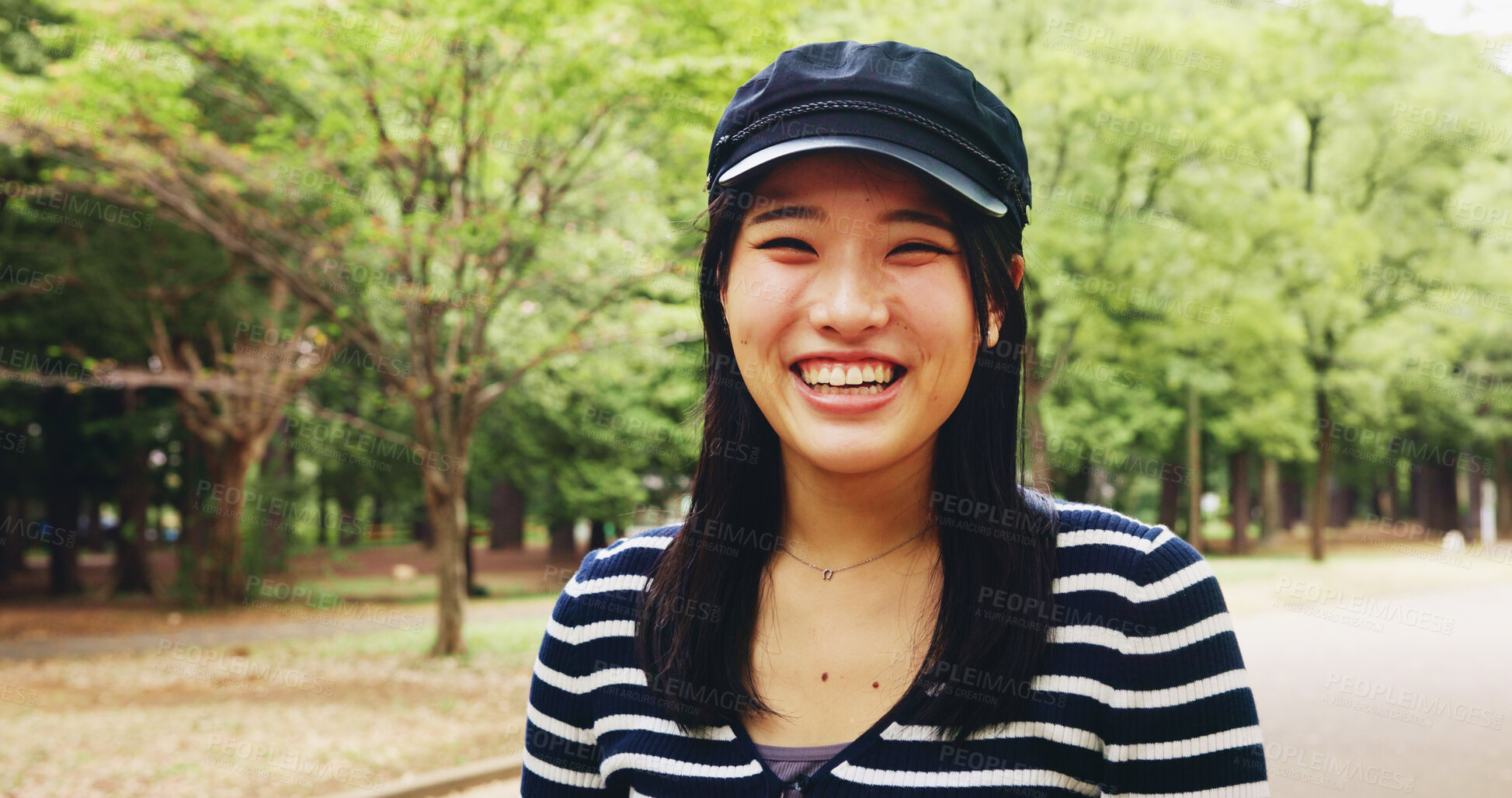 Buy stock photo Woman, portrait and laugh in park with fashion, travel and student on study break in Tokyo. Japanese girl, happy and outdoor with style for commute, weekend fun and vacation with brand accessories