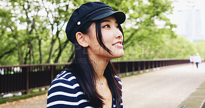 Buy stock photo Japanese, woman and thinking as tourist outdoor for travel decision, sightseeing and bridge view in city. Girl, thoughts and hat with morning commute, abroad tourism and destination planning in Japan