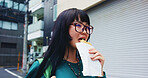 Pastry, eating and woman with food in city on vacation, adventure or weekend trip for journey. Happy, travel and hungry Japanese female person enjoying Taiyaki for lunch in urban town on holiday.