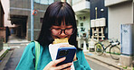 Browsing, smile and woman with smartphone, snack and reading of timetable for exam, eating and campus. Outdoor, education and Asian person with food, scroll and check of schedule, mobile and Japan