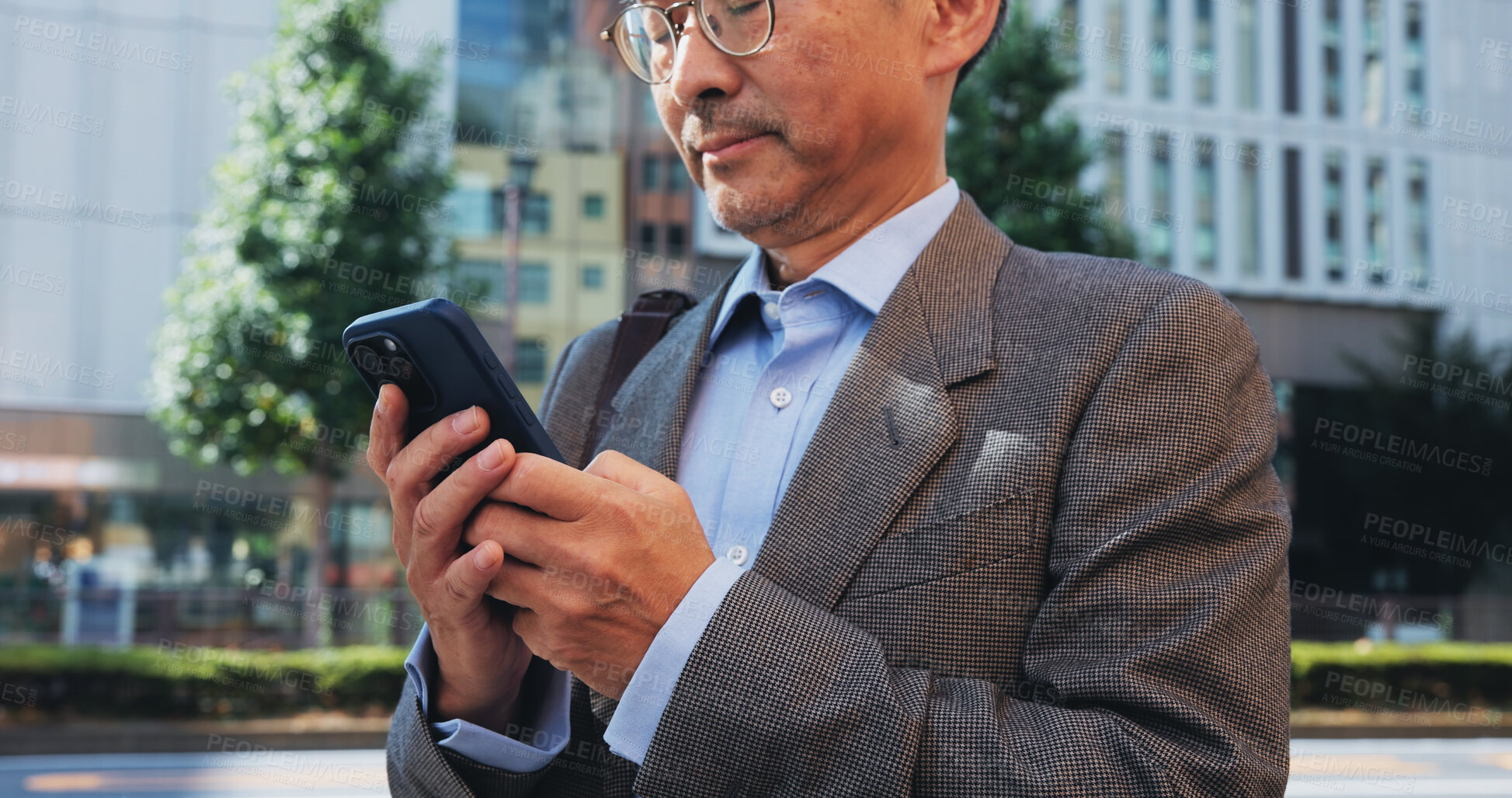 Buy stock photo Phone, hands and businessman in city for contact, email or networking with online investor. Technology, communication and finance executive on cellphone for company revenue report in town in Japan.