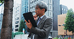 Businessman, tablet and thinking in city for research, communication or networking client with idea. Japanese person, technology and mature architect for planning, development or proposal with vision