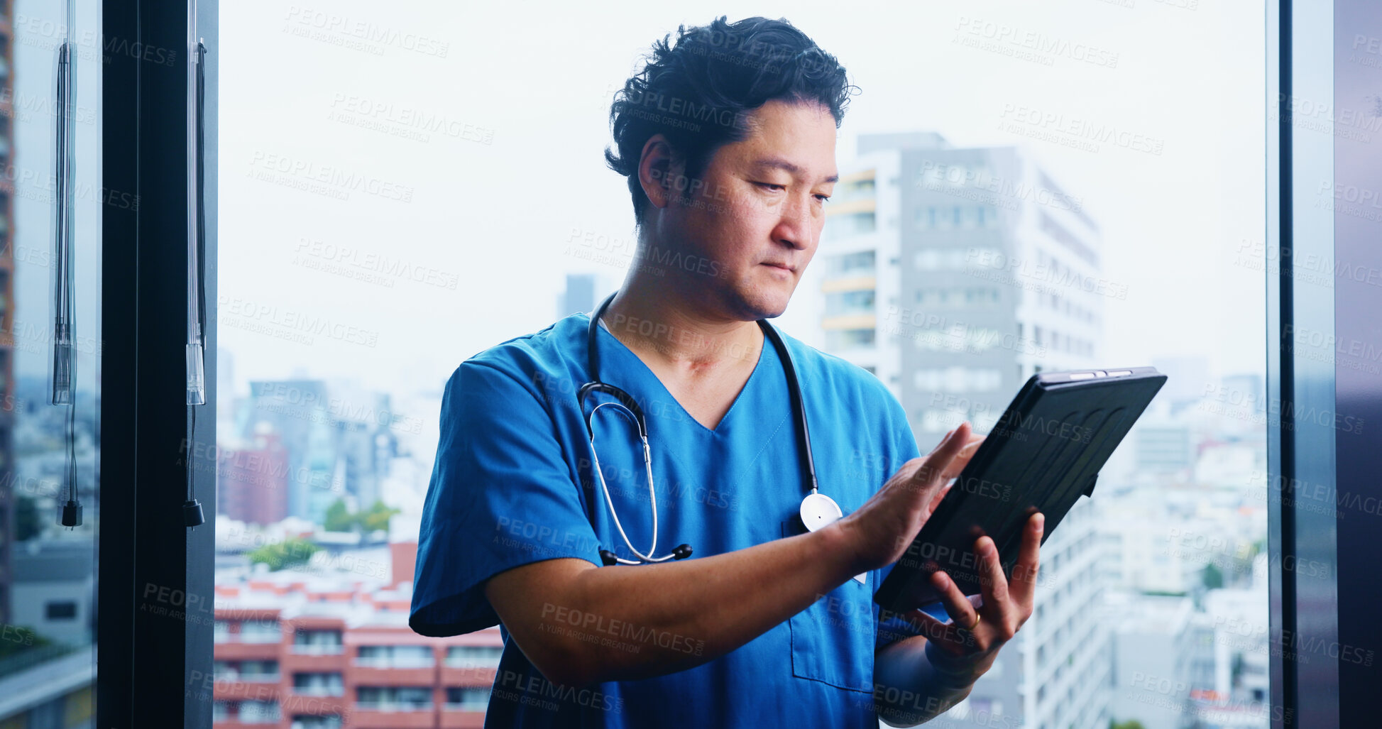 Buy stock photo Japanese, man and surgeon with tablet for test results, medical research or appointment booking. City, window or doctor with touchscreen for online browsing, schedule or health app at hospital clinic