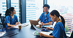 Asian people, nurse or team with documents in meeting for medical discussion, planning or budget at hospital. Japan, group or healthcare employees with paperwork or laptop for clinic expenses or fund