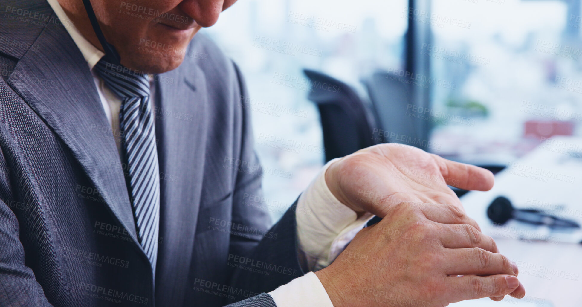 Buy stock photo Man, business hands and wrist pain in office from muscle ache, inflammation or carpal tunnel syndrome. Japanese firm, professional person and joint sprain with arthritis, uncomfortable and discomfort