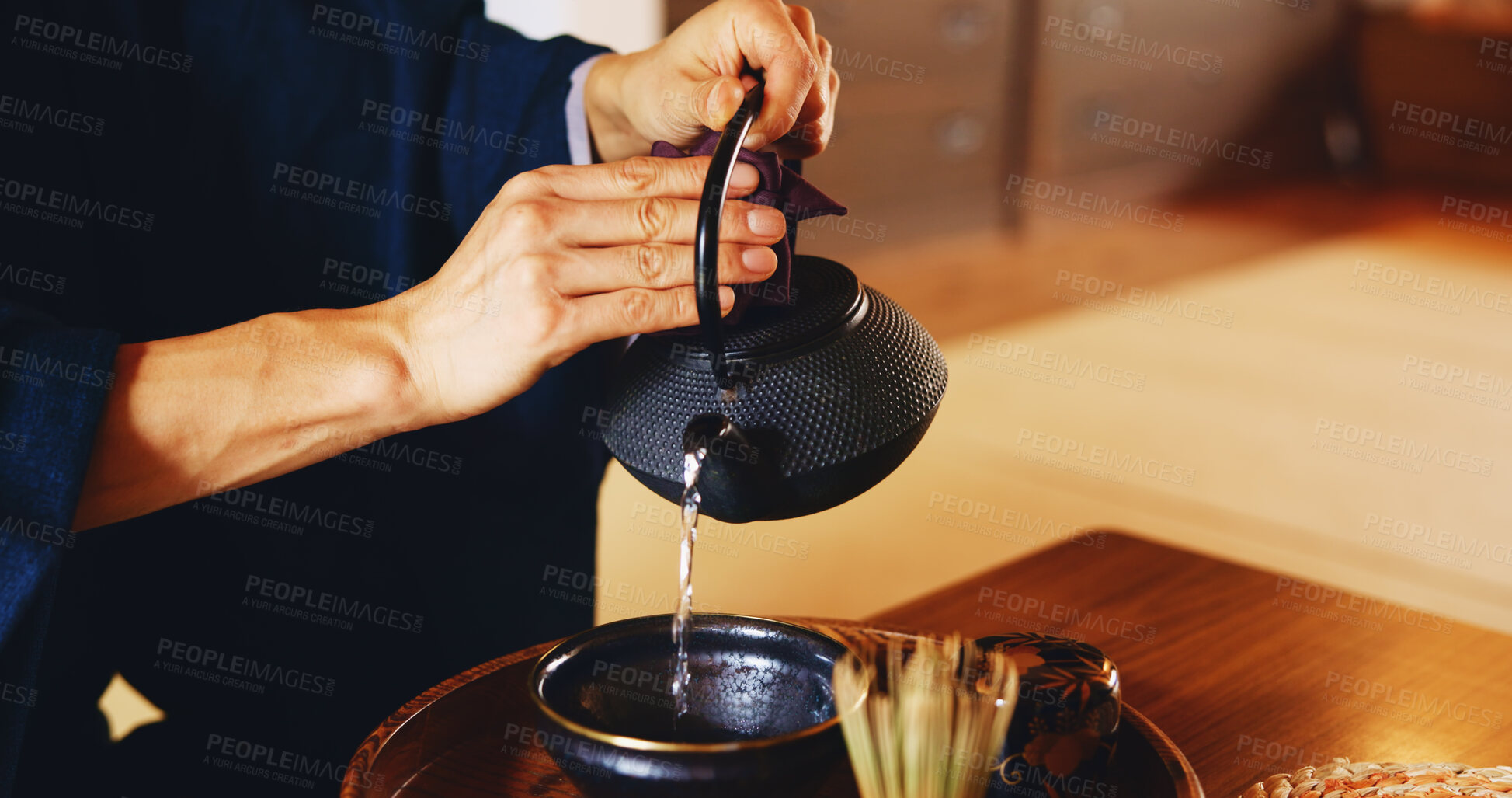 Buy stock photo Man, pour and tea ceremony in Japan for tradition, culture and matcha in home with preparation. Male person, ritual and relax for mindfulness, zen and buddhism with spiritual, respect and harmony