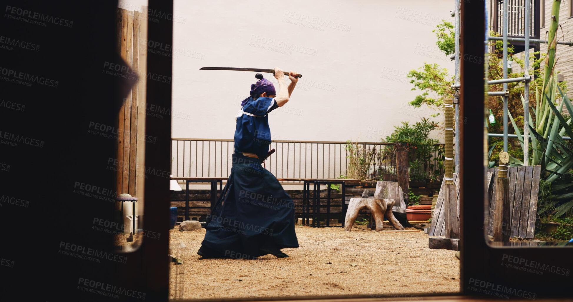 Buy stock photo Dojo, Kenjutsu and sword with man in Japan for combat, martial arts or training, Culture, fighting form and weapon with Japanese Samurai in kendogi for discipline, exercise or practice routine