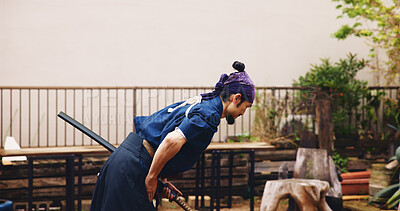 Buy stock photo Bowing, dojo and sword with Samurai man in Japan for combat, martial arts or training, Culture, respect and weapon with Japanese person in kendogi for discipline, exercise or to practice Kenjutsu
