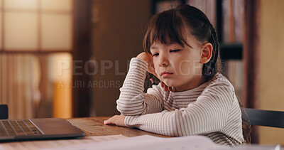 Buy stock photo Girl, child and bored with homework, reading and frustrated with learning disability, tired or adhd in family house. Kid, sad and thinking with laptop, books and online course for education in Japan